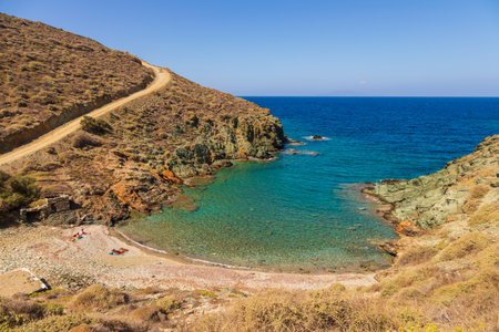 Folegandros Island, Greece - 25 September 2020: View of the coast and Ligaria beach of the island of Folegandros. People on the beach. Aegean Sea, Cyclades Archipelago.のeditorial素材