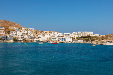 Folegandros Island, Greece - 25 September 2020: Cutters and boats moored in Karavostasi marina on the island of Folegandros. White villas in the background.のeditorial素材