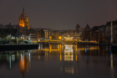 Gdansk, Poland - 02 February 2021: A view of the footbridge over the Motlawa River connecting the...