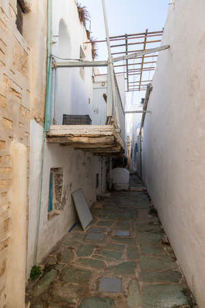 A narrow side street in Chora, old town. Characteristic Greek buildings. Folegandros Island, Greece.の写真素材