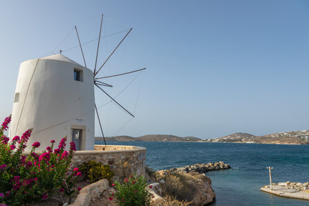 Parikia, Paros Island, Greece - 26 September 2020: Iconic, traditional windmills. Sea in the background.のeditorial素材