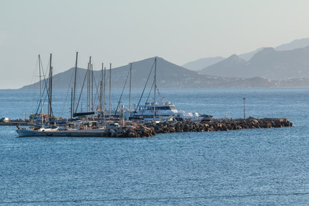 Piso Livadi, Paros Island, Greece - 27 September 2020: Catamaran and yachts moored in the port.のeditorial素材
