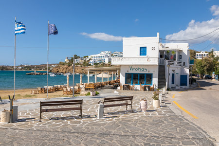 Piso Livadi, Paros Island, Greece - 27 September 2020: View of the main square of port town with local restaurants. Outside tables for guests.のeditorial素材