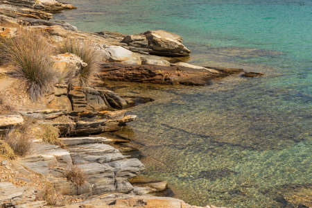 View of the rocky coast at Monasteri Beach. One of the most popular beaches on the island of Paros. Greece.の写真素材