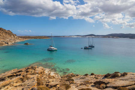 View of the rocky coast at Monasteri Beach. One of the most popular beaches on the island of Paros. Greece.の写真素材