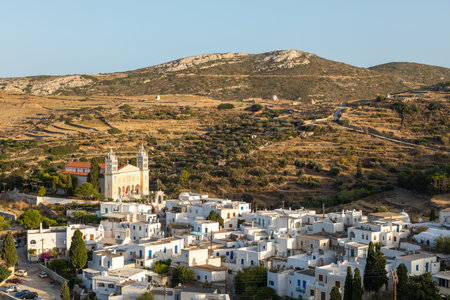 Lefkes, Paros Island, Greece - 27 September 2020: View of the Saint Ioannis Kleidonias in the center of Lefkes. High building against the backdrop of the mountains.のeditorial素材