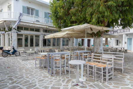 Antiparos Port, Antiparos Island, Greece - 28 September 2020: Narrow street of the old town. Traditional, withe architecture and a stone path with white joints.のeditorial素材