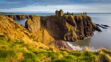 View of the ruins of the 13th century Dunnottar Castle, medieval fortress. Aberdeenshire,...