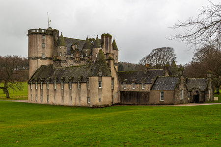 Inverurie, Scotland, UK - 06 February, 2016: The rear side of ancient Castle Fraser in Sauchen, Inverurie, Scotland and green gardens.のeditorial素材