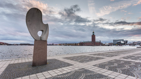 Stockholm, Sweden - 18 April 2016: Modern sculpture on Evert Taubes Terrass. Stadshuset, Stockholm City Hall in the background.のeditorial素材