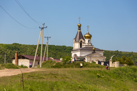Orheiul Vechi, Trebujeni, Republic of Moldova - 01 May 2016: A view of the on St. Mary Church with belfry in Reut river valley in Trebujeni, natural landscape of limestone rock.のeditorial素材