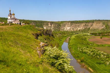 Orheiul Vechi, Trebujeni, Republic of Moldova - 01 May 2016: A view of the on St. Mary Church with belfry in Reut river valley in Trebujeni, natural landscape of limestone rock.のeditorial素材