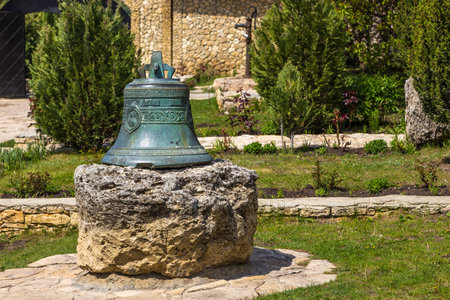 Butuceny, Republic of Moldova - 01 May 2016: Big bell at the on St. Mary Church in Reut river valley, natural landscape of limestone rock.のeditorial素材