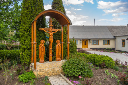 Pripiceni-Curchi, Republic of Moldova - 01 May 2016: View of the Monastery The Holy Great Martyr Dumitru. Wooden cross.のeditorial素材