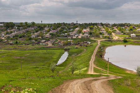 A view of a small Moldavian village. Rural landscape. Dezinghea, Republic of Moldova.の写真素材