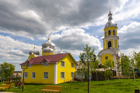 Comrat, Gagauzia, Republic of Moldova - 02 May 2016: Bell Tower of Comrat Cathedral. The Autonomous Region of Gagauzia. A beautiful yellow church in central park.のeditorial素材