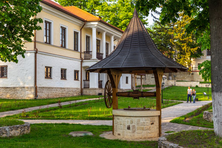 Capriana, Republic of Moldova - 02 May 2016: Capriana monastery, one of the oldest, established in medieval Moldova. Well, a water intake point in front of.のeditorial素材
