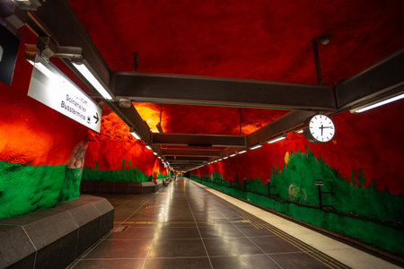 Stockholm, Sweden - June 25, 2016: Solna Centrum Station, metro station carved out of the rock. Red walls with painting.のeditorial素材