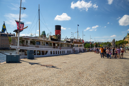 Stockholm, Sweden - June 25, 2016: Tourist ship moored in Gamla Stan. Center of capital city.のeditorial素材