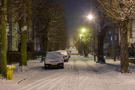 Poland, Gdansk, Oliwa - 23 February 2018: View of the illuminated, snow-covered old town in Oliwa. Winter cityscape.のeditorial素材