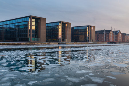 Copenhagen, Denmark- 06 March 2018: View of the modern buildings in Copenhagen. Winter season. Floe floating on the bay.のeditorial素材