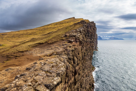 View of the Slave Cliff and Leitisvatn Lake on Vagar Island. Beautiful landscape. Faroe Islands.の写真素材