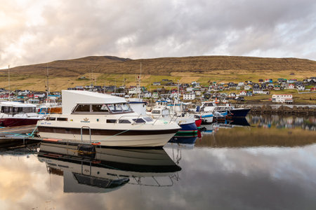 Sandavagur, Faroe Island - 29 April 2018: View of the small port in Sandavagur on Vagar island. A small village situated on the slope of a hill.のeditorial素材
