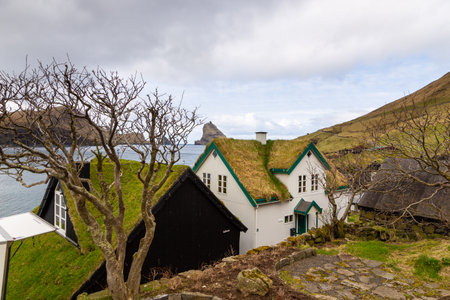 Bour, Faroe Islands - 30 April 2018: View of the Bour on Vagar island. A small village situated on the slope of a hill.のeditorial素材