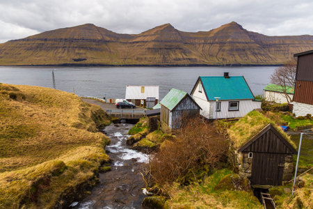 Kunoy, Faroe Islands - 02 May 2018: View of the Kunoy on Kalsoy island. A small village situated on the slope of a hill.のeditorial素材