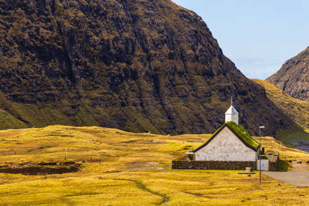 View of the Saksunar Church, Kirkja in small village on Streymoy island. Sunny day. Saksun, Faroe Islands.の写真素材