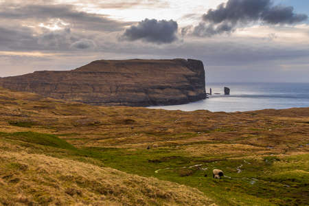Risin og Kellingin rock formations on the coast of Streymoy Island. Coastline cliffs landscape. Eidi, Faroe Islands, Denmark.の写真素材