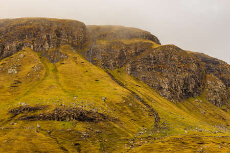 Mountain landscape on the island of Streymoy. Cloudy spring day. Leynar, Faroe Islands, Denmark.の写真素材