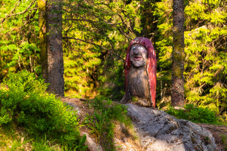 Bergen, Norway - May 28, 2018: Wooden, colorful sculpture mythical creature guard of forest legend. Floyen hill.のeditorial素材