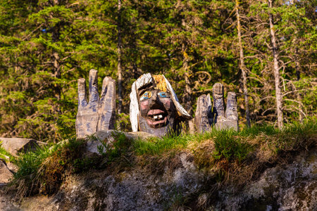 Bergen, Norway - May 28, 2018: Wooden, colorful sculpture mythical creature guard of forest legend. Floyen hill.のeditorial素材