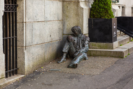 Bergen, Norway - 28 May 2018: A statue entitled The homeless by sculptor, Arne Maeland. Monument to man at the entrance to the bank. Bergen, Norway, Europe.のeditorial素材