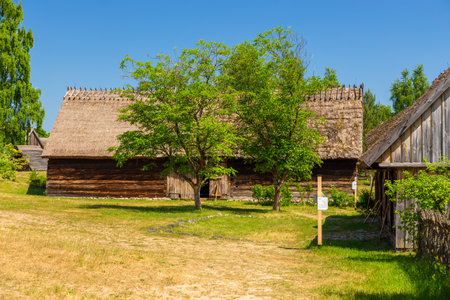 Wdzydze Kiszewskie, Poland - 31 May 2018: Wooden barn in open-air museum, Kashubian Ethnographic Park.のeditorial素材
