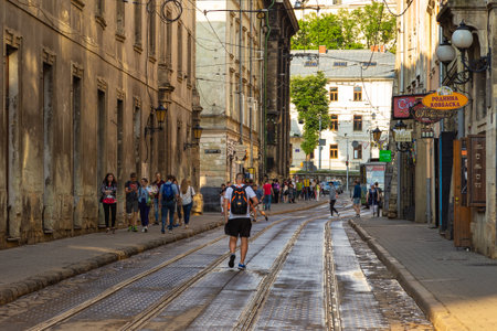 Lviv, Ukraine - 08 June 2018: Traditional buildings in a cobblestone street in historical Old town of Lviv.のeditorial素材