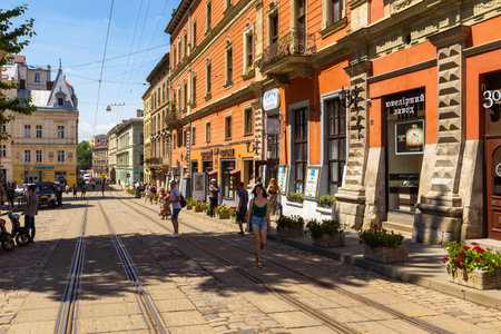 Lviv, Ukraine - 09 June 2018: Traditional buildings in a cobblestone street in historical Old town...