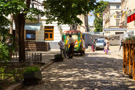 Lviv, Ukraine - 09 June 2018: Traditional buildings in a cobblestone street in historical Old town of Lviv.のeditorial素材