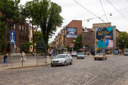Lviv, Ukraine - 09 June 2018: Traditional buildings in a cobblestone street in historical Old town of Lviv.のeditorial素材