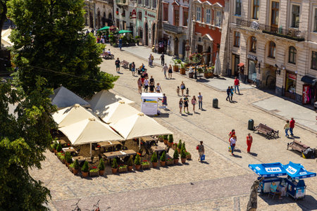 Lviv, Ukraine - 09 June 2018: Lviv City Hall on the Market Square. Traditional buildings in a...