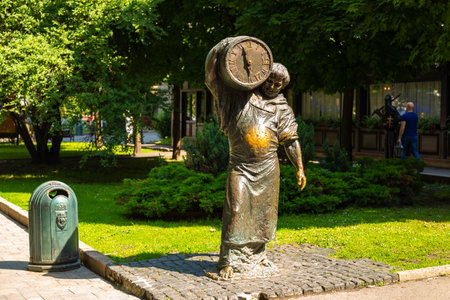 Lviv, Ukraine - 09 June 2018: Monk brewer statue. A statue of a man with a barrel of beer. The sculpture is made of bronze.のeditorial素材