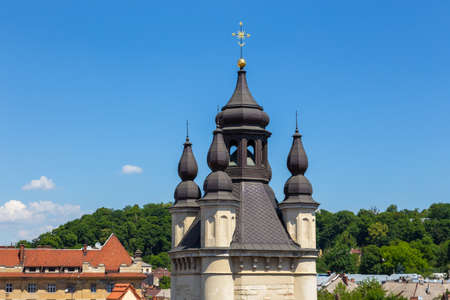 View of the roofs of the historical Old city of Lviv. Church towers in the background. Ukraine.