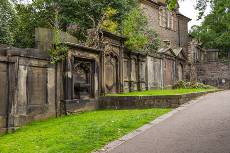 Edinburgh, Scotland - 11 August 2018: The old cemetery next to the The Parish Church of St Cuthbert in the center of old town.のeditorial素材