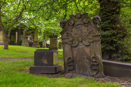 Edinburgh, Scotland - 11 August 2018: The old cemetery next to the The Parish Church of St Cuthbert in the center of old town.のeditorial素材