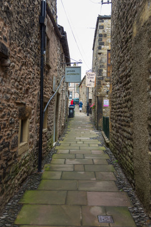 Kirkby Lonsdale, Cumbria, England - August 12, 2018: Narrow streets in the market town. Traditional stone and white houses.のeditorial素材