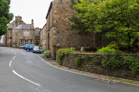 Kirkby Lonsdale, Cumbria, England - August 12, 2018: Narrow streets in the market town. Traditional stone and white houses.のeditorial素材