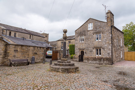Kirkby Lonsdale, Cumbria, England - August 12, 2018: Narrow streets in the market town. Traditional stone houses.のeditorial素材