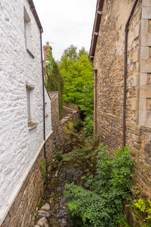 Facade of a stone building in the village of Dent in the Yorkshire Dales, Dent, UKの写真素材