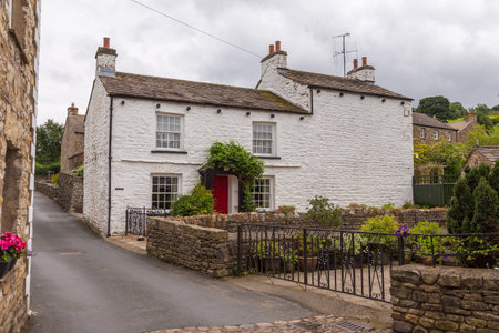Dent, Cumbria, UK, 12 August 2018 - Facade of a stone building in the village of Dent in the...